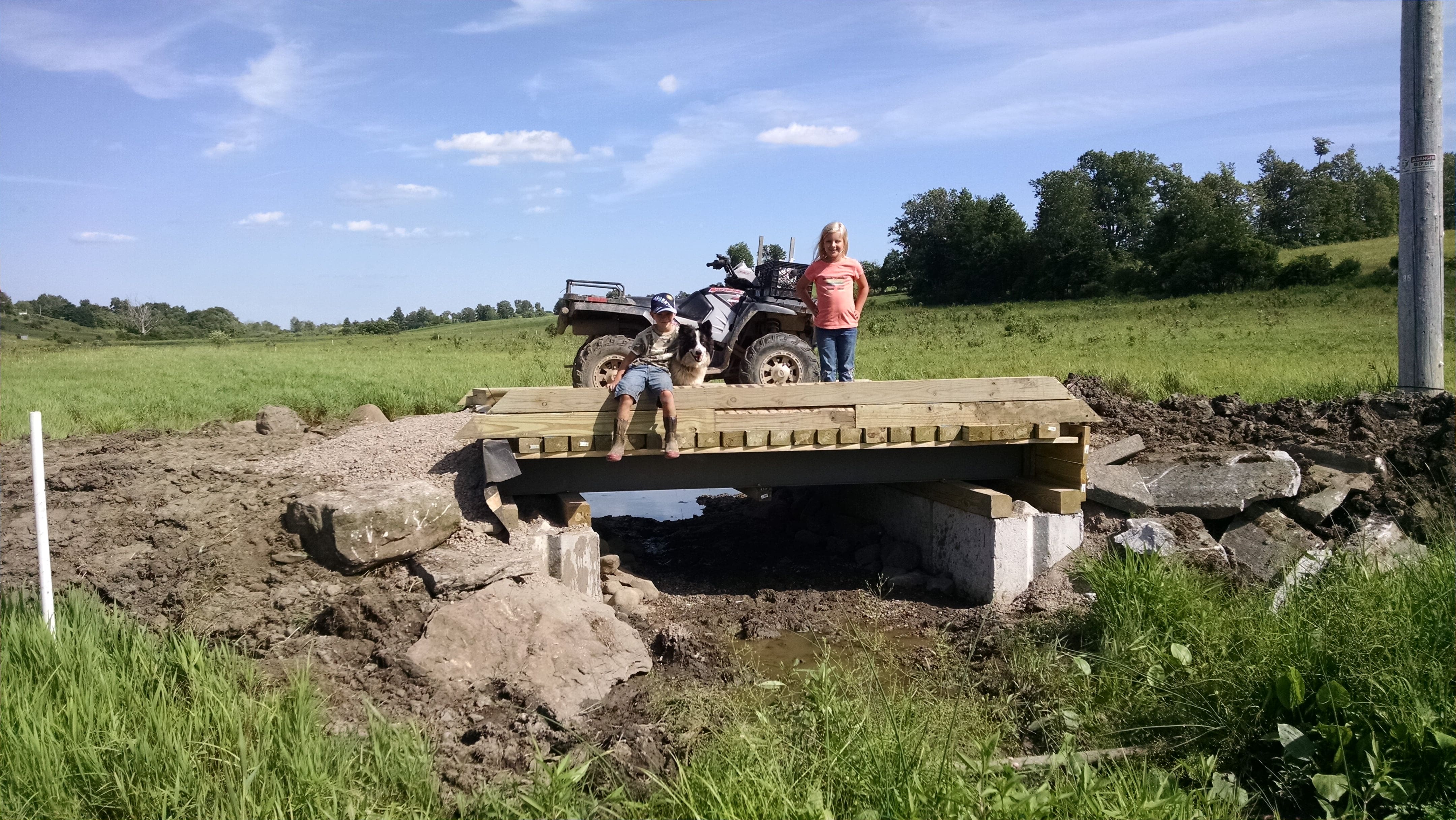 The approaches still need to be graded, the embankments still need to be armored in rip rap, and the decking still needs running boards, but it is good to have the bulk of the project in place.