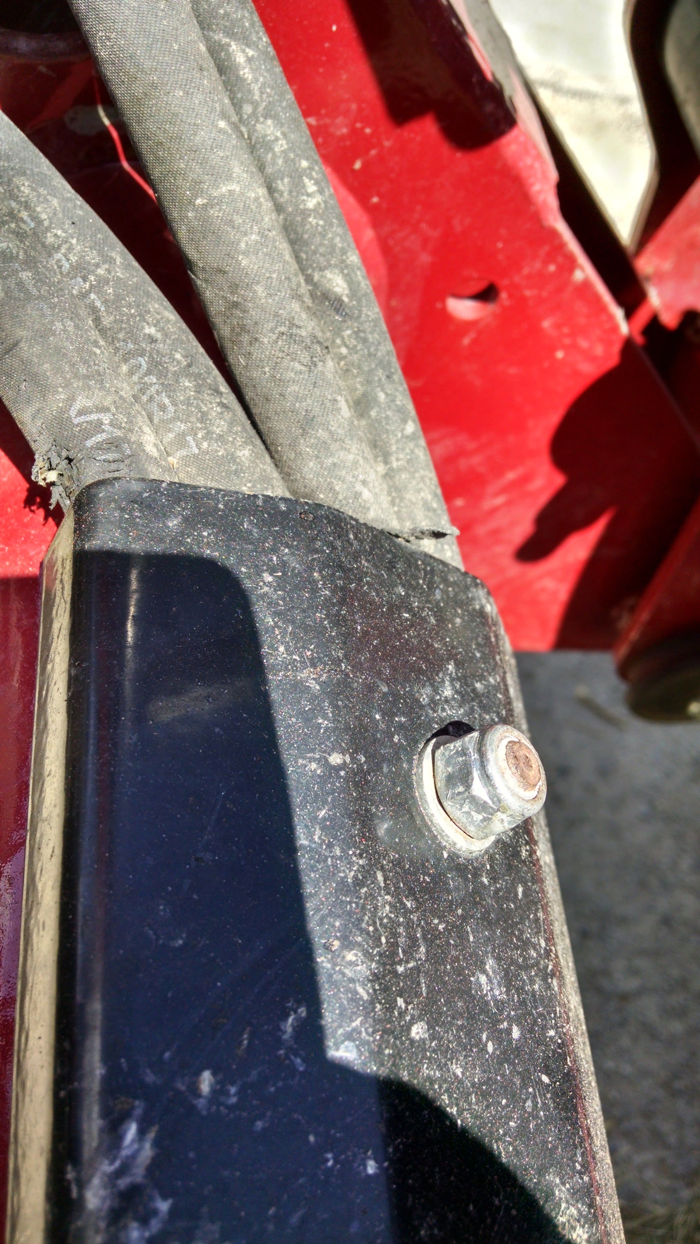 Note the wear on the hose on the left and on the second from right. The rubber is worn down to the reinforcing wire on both hoses.
