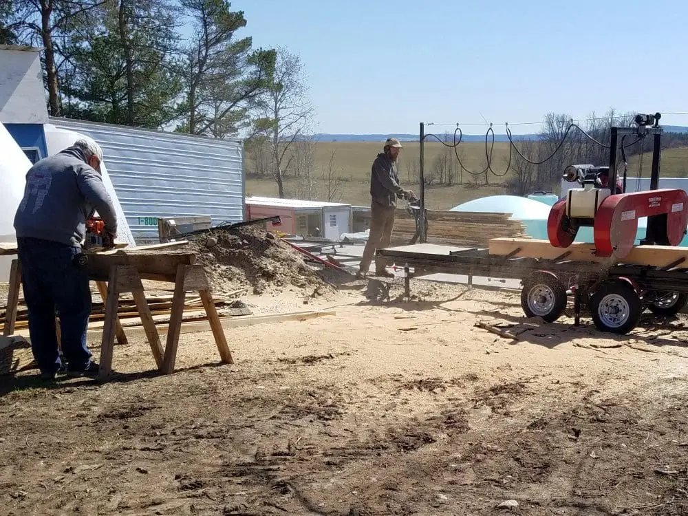 Reclaiming lumber from storm damaged trees.