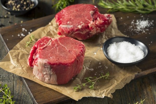 Raw Grass Fed Filet Mignon Steak with Salt and Herbs